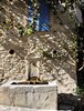 A fountain in the shadows in medieval Vaison